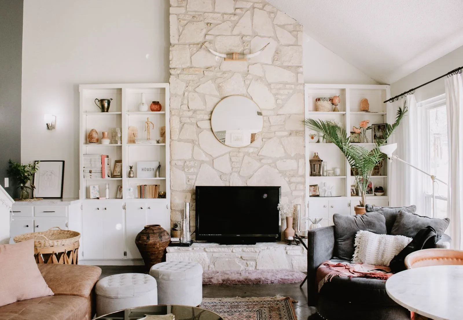 Elegant living room in Austin, TX featuring a stone fireplace and modern decor.